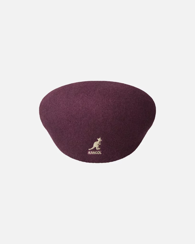 Vue de la casquette Wool 504 USA de KANGOL — laine feutrée, coupe flat-cap, visière courte, logo kangourou brodé, plusieurs coloris possibles.